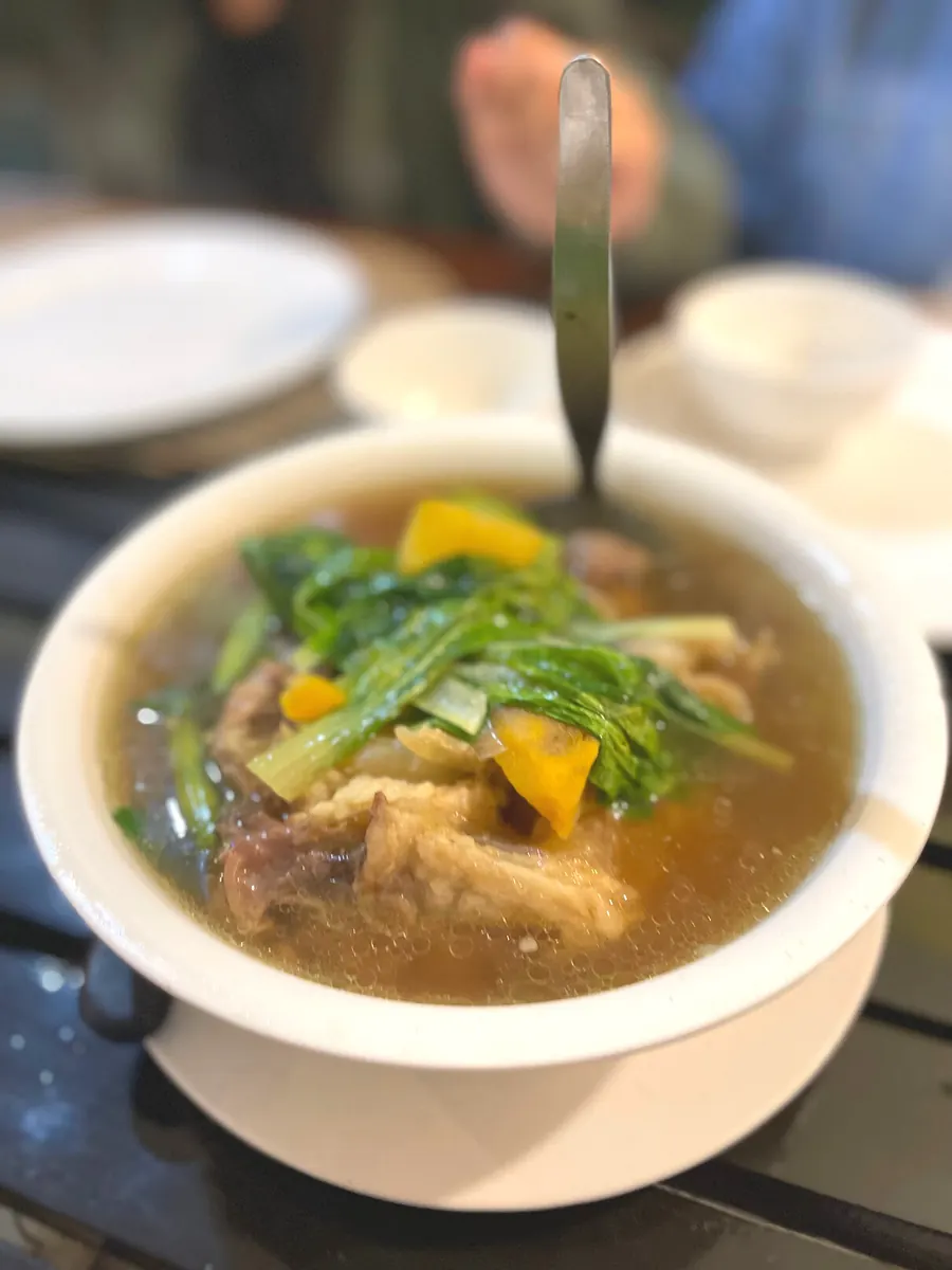 Nilagang baka served in a white bowl